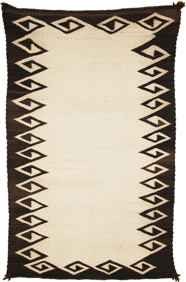 brown and white navajo double saddle blanket